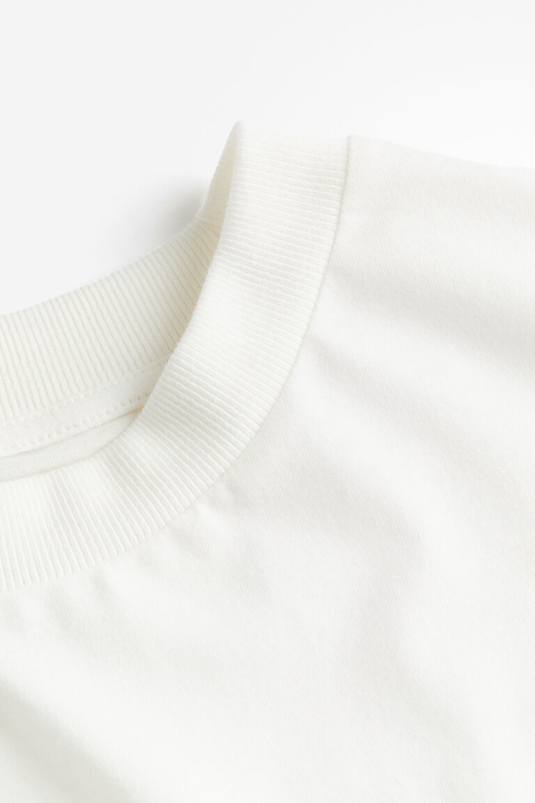 A .   OVERSIZED PRINTED T - SHIRT