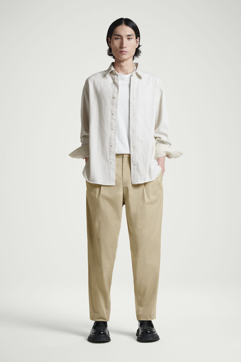 PLEATED COTTON TAPERED TROUSERS