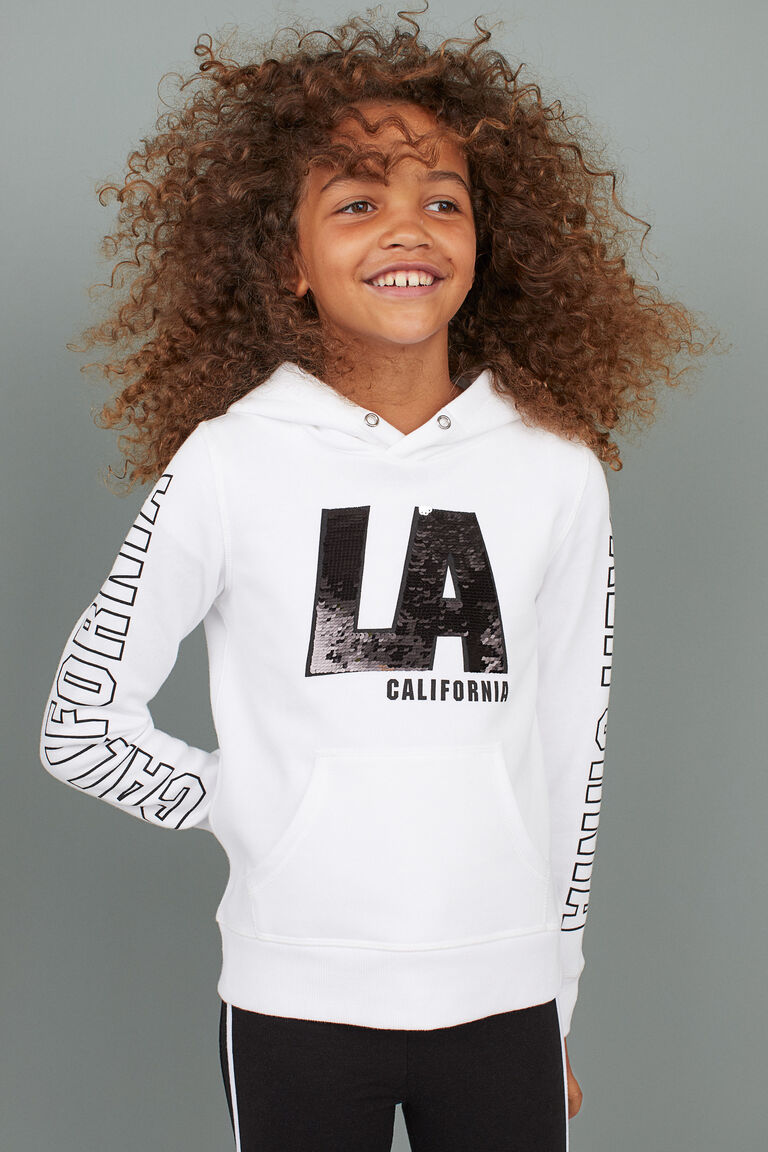 Hooded top with a motif