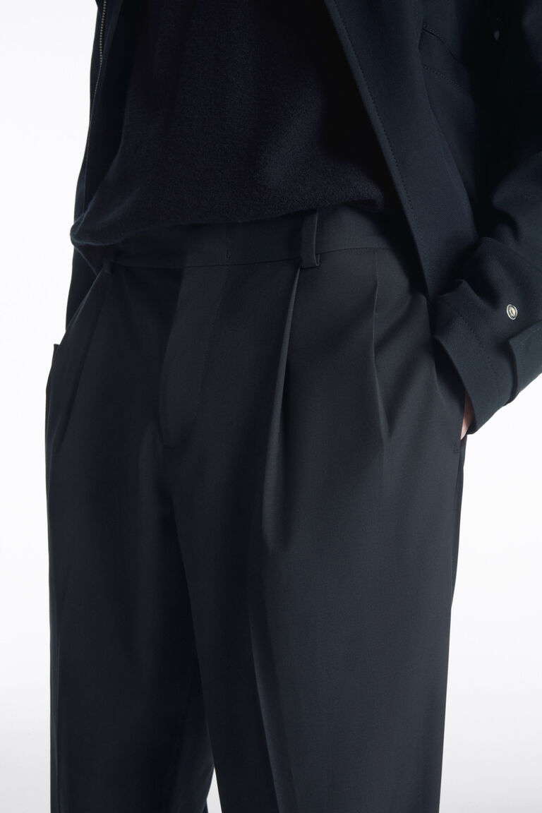 PLEATED TECHNICAL WOOL TROUSERS