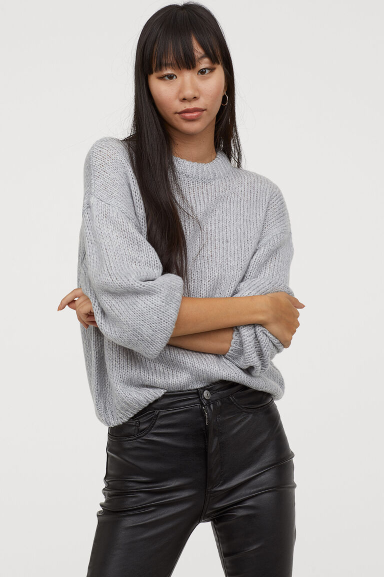 grey trousers black jumper