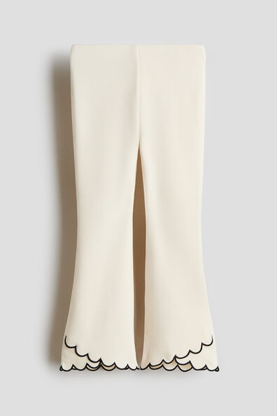 Scalloped-hem flared leggings