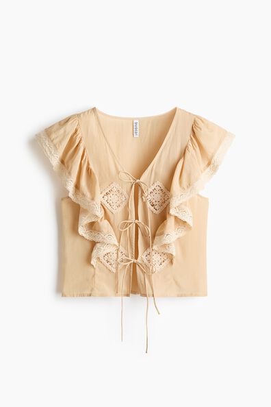 Lace-trimmed flounced blouse