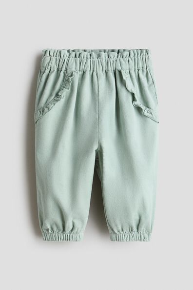 Frill-trimmed corduroy trousers