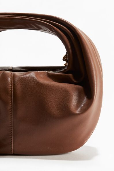 Rounded crossbody bag