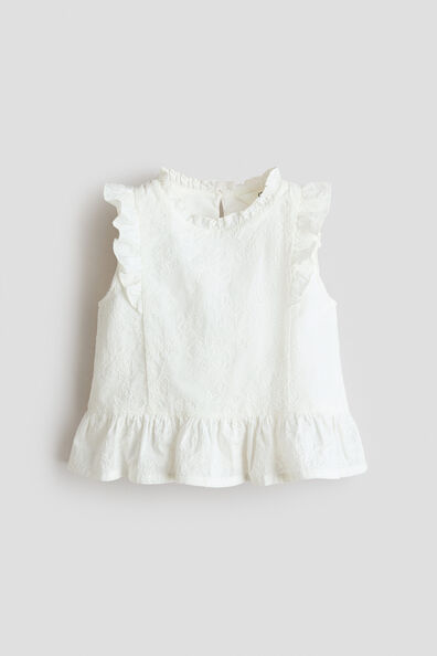 Embroidered cotton peplum top