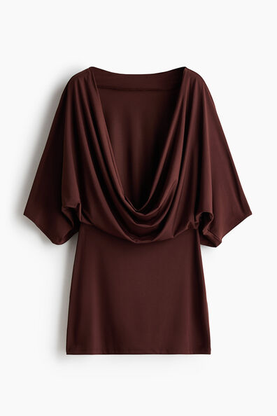 Cape-sleeved low-back dress