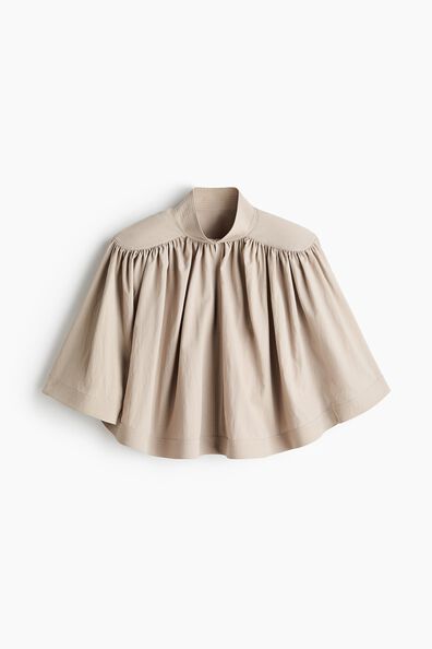 Shoulder-pad cape blouse
