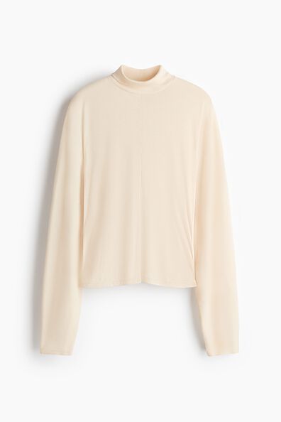 Batwing-sleeved turtleneck top