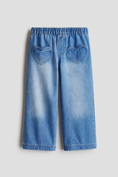 Wide-leg denim trousers
