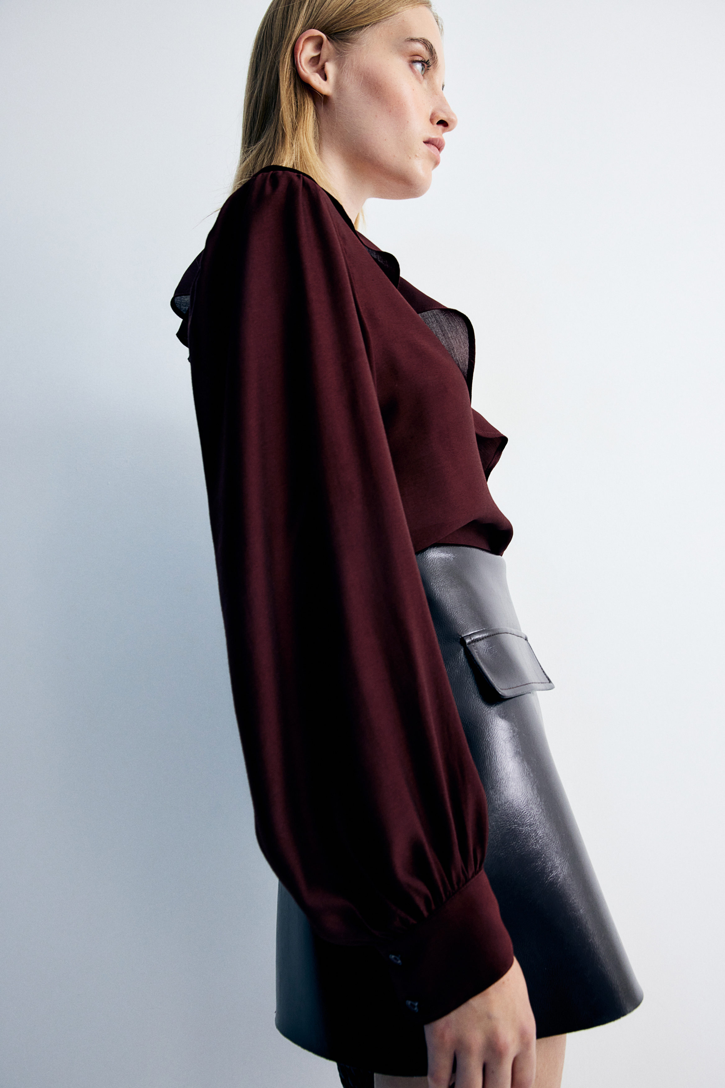 Flounce-trimmed blouse