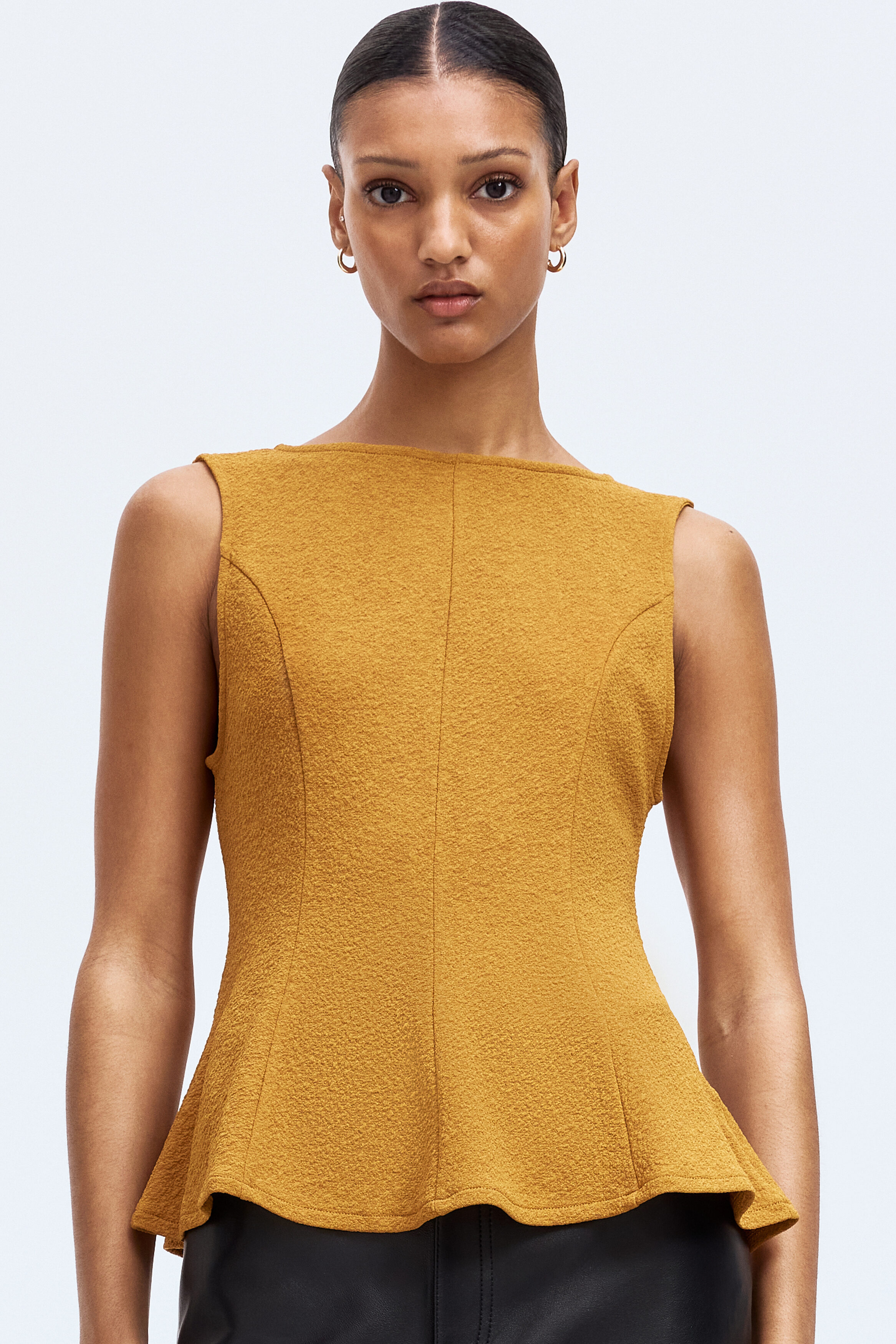 Sleeveless peplum top