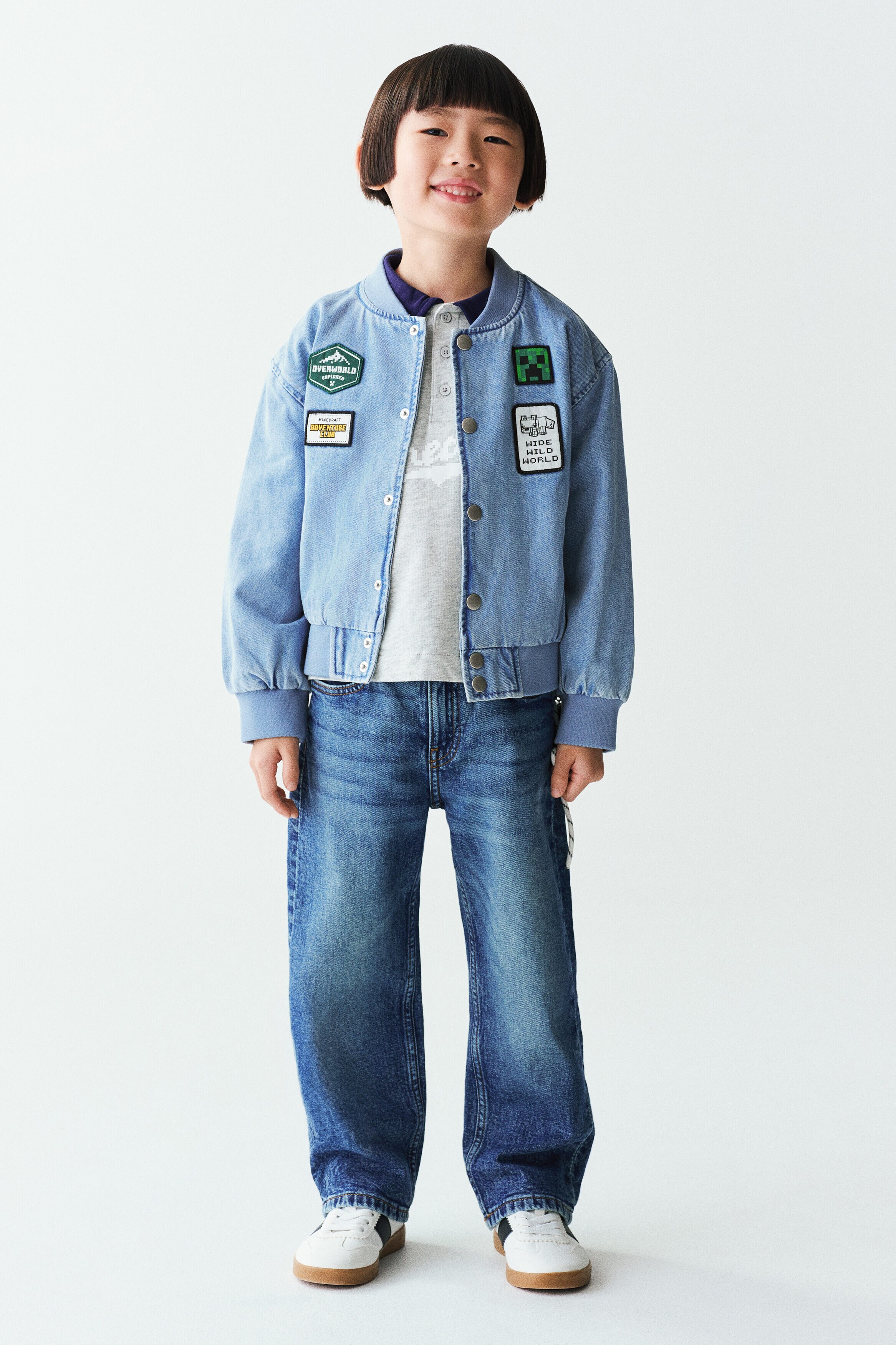 Appliquéd denim bomber jacket