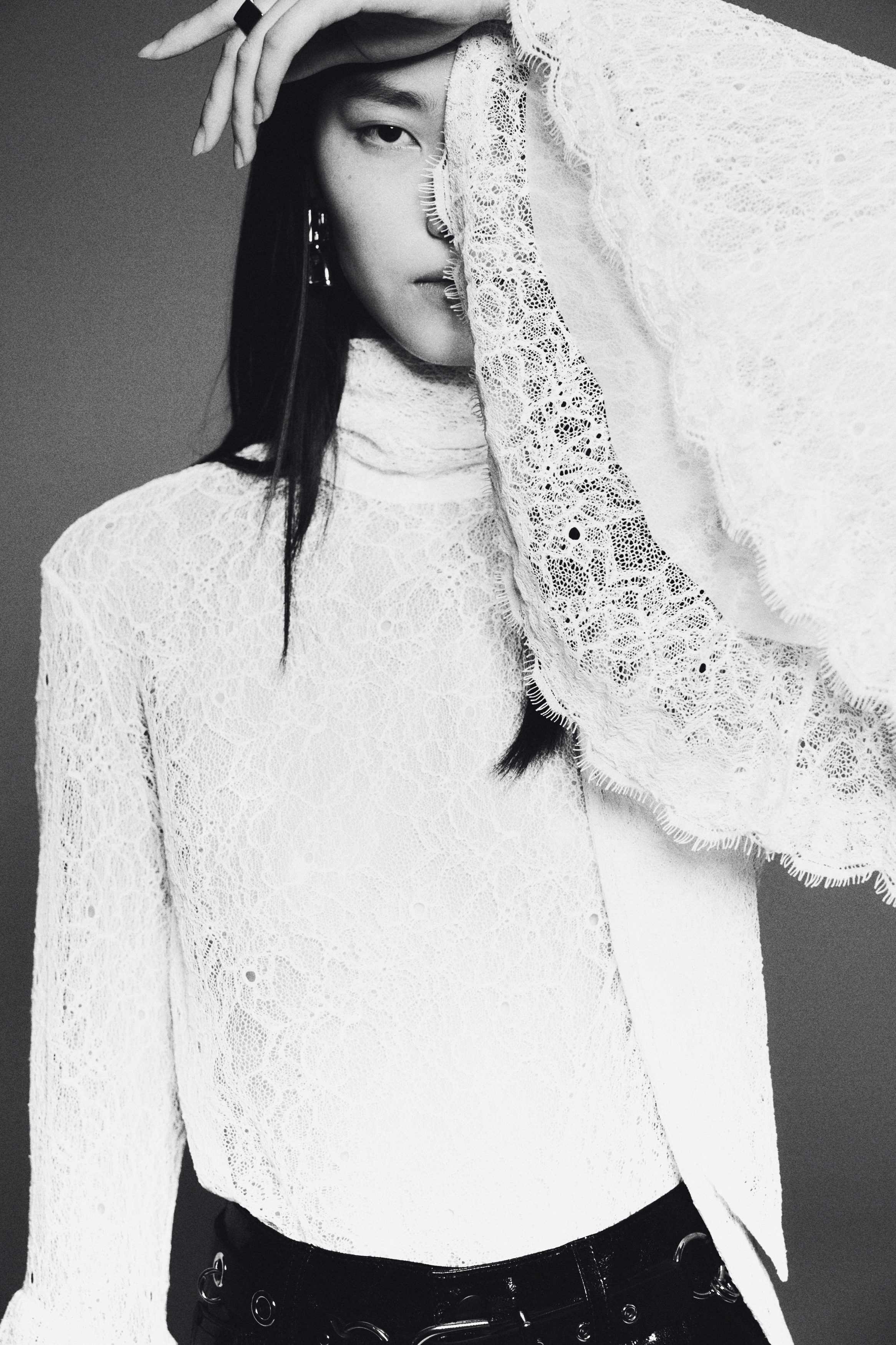 Trumpet-sleeved lace blouse